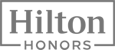 Logo of Hilton Honors with bold text and a border frame, in grayscale.